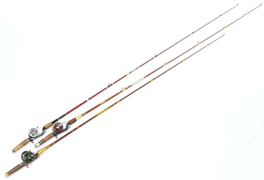 THREE HEDDON FISHING RODS AND REELS.: American, mid 20th century. Includes a Heddon Pal Mark I rod with a Heddon Pal P-41 reel, a Heddon Pal Mark III rod with a Heddon Mark IV reel, and a Heddon Pal Mark IV rod with a Heddon Heritage 35 r