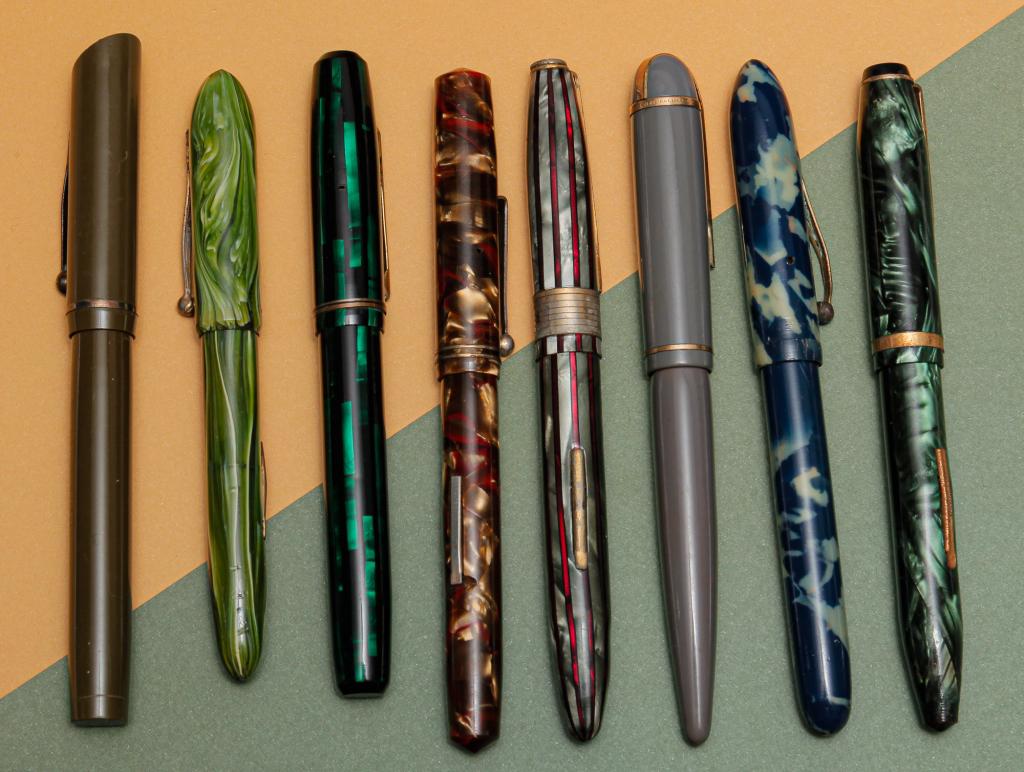 COLORFUL GROUP OF VINTAGE FOUNTAIN PENS.: 20th century. Assortment of eight vintage fountain pens to include: gray Eversharp Skyline lever fill with 14K nib; khaki green Morrison with embossed barrel, 14K nib, eagle on end cap; two Arnold lev