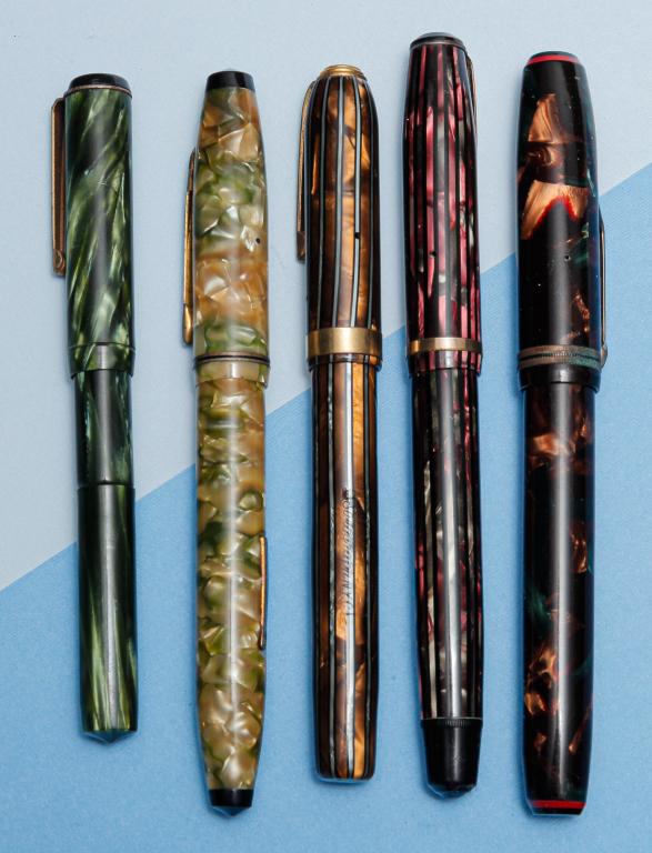 FIVE VINTAGE FOUNTAIN PENS & LEATHER CASE.: First half - 20th century. Group includes: Universal stylograph lever fill stylo pen; Wearever pacemaker fountain pen, 14K nib; unmarked green marbled lever fill; Conklin green marbled slender shape; 