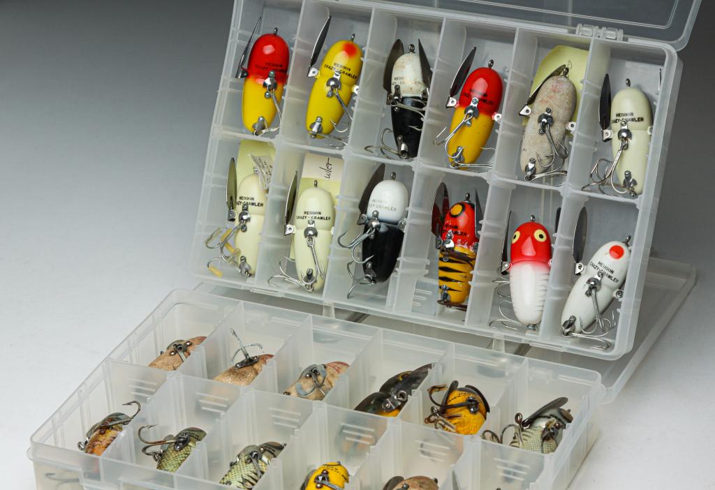 TWENTY-FOUR HEDDON CRAZY-CRAWLER FISHING LURES.: Group of twenty-four Heddon Crazy-Crawler fishing lures. All are stored in two plastic tackle boxes.