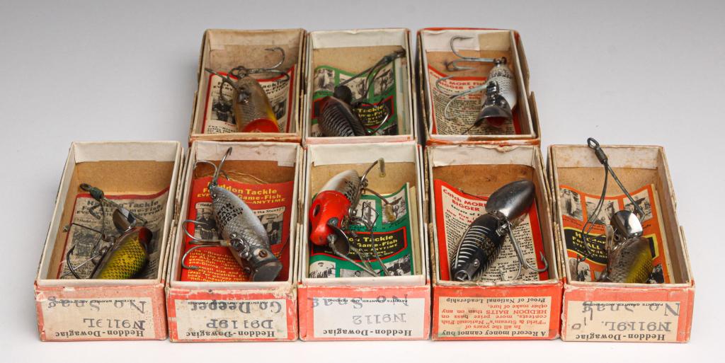 EIGHT HEDDON BAIT LURES INCLUDING NO SNAG.: First half, 20th century. Group of eight Heddon lures. Includes four River Runt No-Snag, three Go-Deeper, and a Chugger-Spook. All are in original boxes, most with paper inserts.