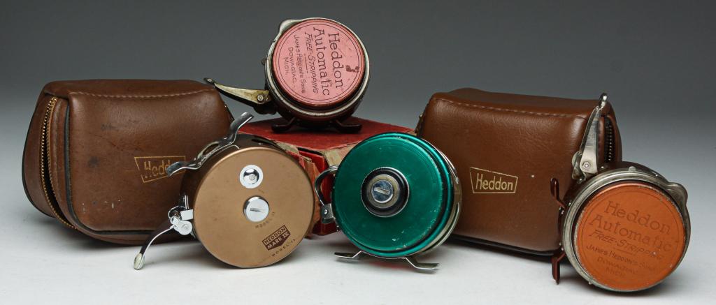 FOUR "HEDDON" FLY REELS.: Mid 20th century. All marked. Two "Heddon Automatic Free Stripping... No. 57" with one damaged box. And two in faux leather pouches. "Heddon 10" and "Heddon Mark IV Model 11". One pouch has wrench and