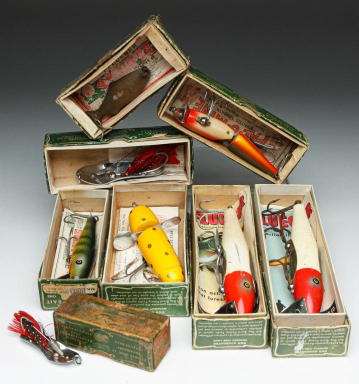 EIGHT PFLUEGER FAMOUS BAIT FISHING LURES & BOXES.: Group of eight Pflueger fishing lures. Includes a 2.75" globe spinner, two no. 9596, a no. 9073 rainbow, two chum spoons, a Last Word, and a no. 8603. All are in original boxes with paper inserts.