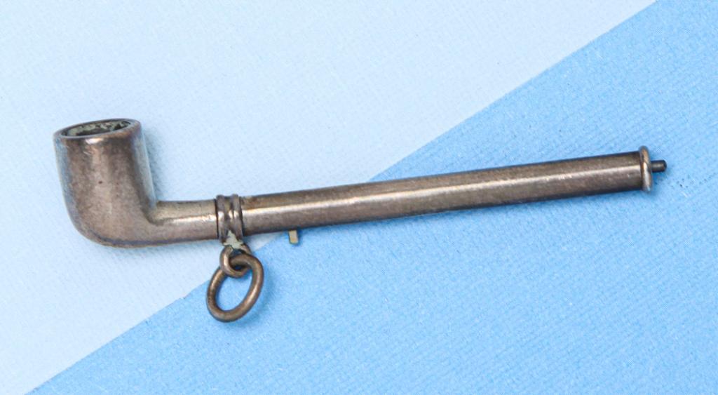 VICTORIAN SILVER PROPELLING PIPE PENCIL.: English, late19th century. Victorian novelty silver propelling pencil made in the form of a pipe, with sliding pin mechanism to extend the pencil, attached suspension ring. 2”closed, 2.5” 