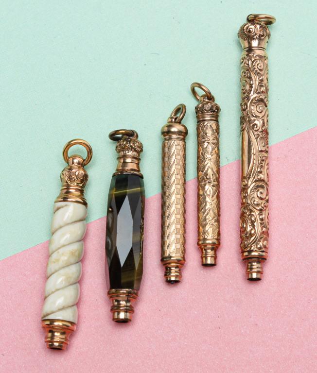 SMALL GROUP VICTORIAN MAGIC PENCILS.: Mid-late 19th century. Five small retractable pencils, gold filled and gold plated, one marked "Fairchild", all with attached suspension rings. Closed lengths approx. 1.5" - 2.75". Good condition, min