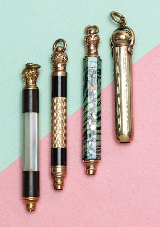 FOUR VICTORIAN MAGIC PENCILS.: Fourth quarter - 19th century. Four pencils: Possibly Hicks magic pencil, stamped "14 ct filled", with swivel and ring suspension sheath; one marked "pearl pat Dec 5 71" with mother of pearl panels ar