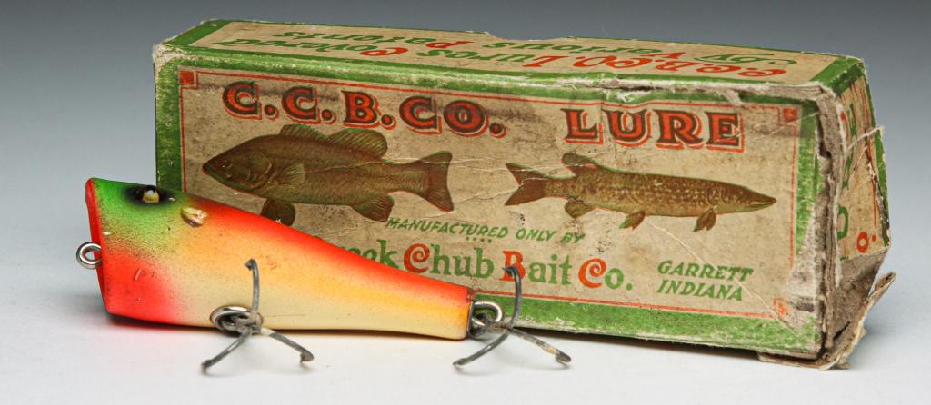 CREEK CHUB BAIT CO. RAINBOW FIRE PLUNKER LURE.: Creek Chub Bait Co. wooden plunker with glass eyes, finished in rainbow fire. Includes original box.