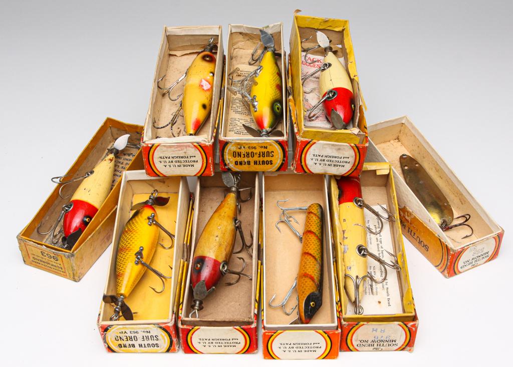 NINE SOUTH BEND FISHING LURES IN ORIGINAL BOXES.: Group of nine South Bend fishing lures. Includes five No. 963 Surf-Oreno lures, a No. 957, a No. 588, a No. 976, and a lure in an unmarked box. All are in original boxes, some having paper inserts.