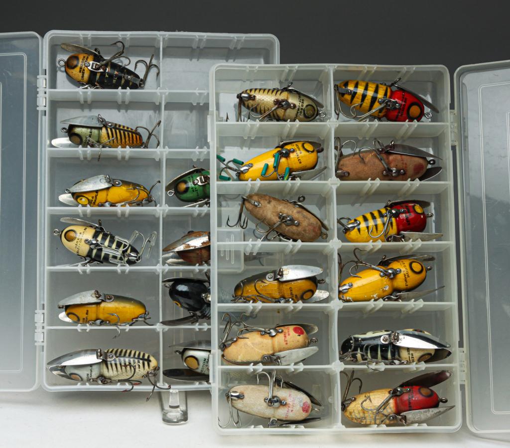TWENTY-TWO HEDDON CRAZY-CRAWLER FISHING LURES.: Group of twenty-two Heddon Crazy-Crawler fishing lures. All are organized in two clear plastic tackle boxes.