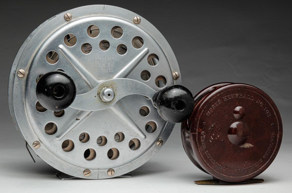 TWO DEEP SEA AND FLY FISHING REELS.: American, 1st half 20th century. Large "Pfleuger Pakron No. 3180" with steel line. Minor wear. 6.25"d. and a bakelite "Weber Henshall No. 103, Weber LifeLIke Fly Co., Steven's Point, Wisc". Minor wear