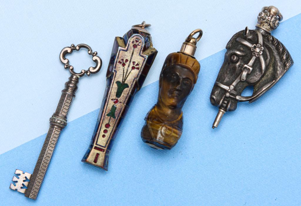 FOUR VINTAGE NOVELTY PROPELLING PENCILS.: Late 19th - early 20th century. Four pencils to include: Egyptian Revival unmarked gilt metal and enamel Tutankhamun propelling pencil, suspension ring, 2" closed, 3.5" open, some wear to enamel; silv