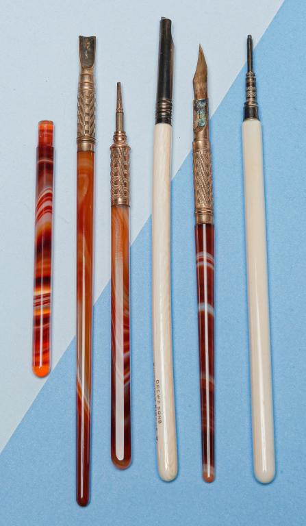 SMALL GROUP ANTIQUE DIP PENS AND PENCILS.: Mid-19th century. Group of six pieces to include: pen and pencil set with carved bone handles marked 'Drew & Sons Piccadilly Circus W.', approx. 6.25"l; two agate handled dip pens, 6" and 6.5"l - one 
