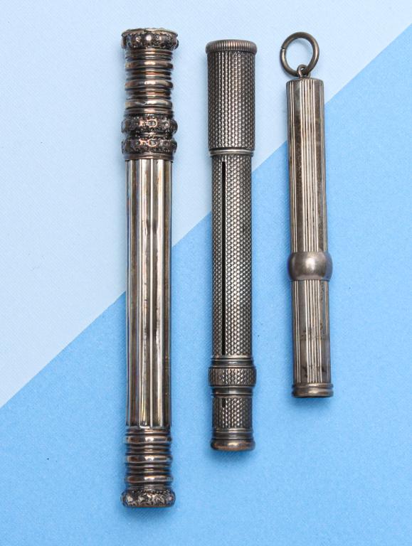 THREE ANTIQUE SILVER PENCIL CASES.: English, 19th century. Three cylindrical cases including: one sterling silver marked "S. Mordan & Co." with hallmarks Birmingham, 1819, 3.5"l; one sterling marked "L&C", with duty mark, 1834, 4"l; Tog