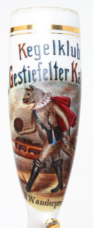 GERMAN PIPE BOWL WITH PUSS IN BOOTS.: Late 19th century. Well done hand painting over transfer on porcelain. Puss in boots at a bowling club "Kegelklub Gestiefelter Kater, VI Wanerpreis". Rim roughness. 5.5"l.