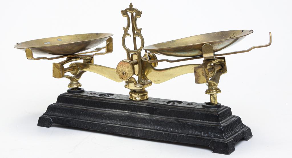SET OF AMERICAN BALANCE SCALES.: Twentieth century, brass and cast iron. Base marked "MG" and pans are from a beam scales. 7.5"h. 5.5"w. 6.75"d.