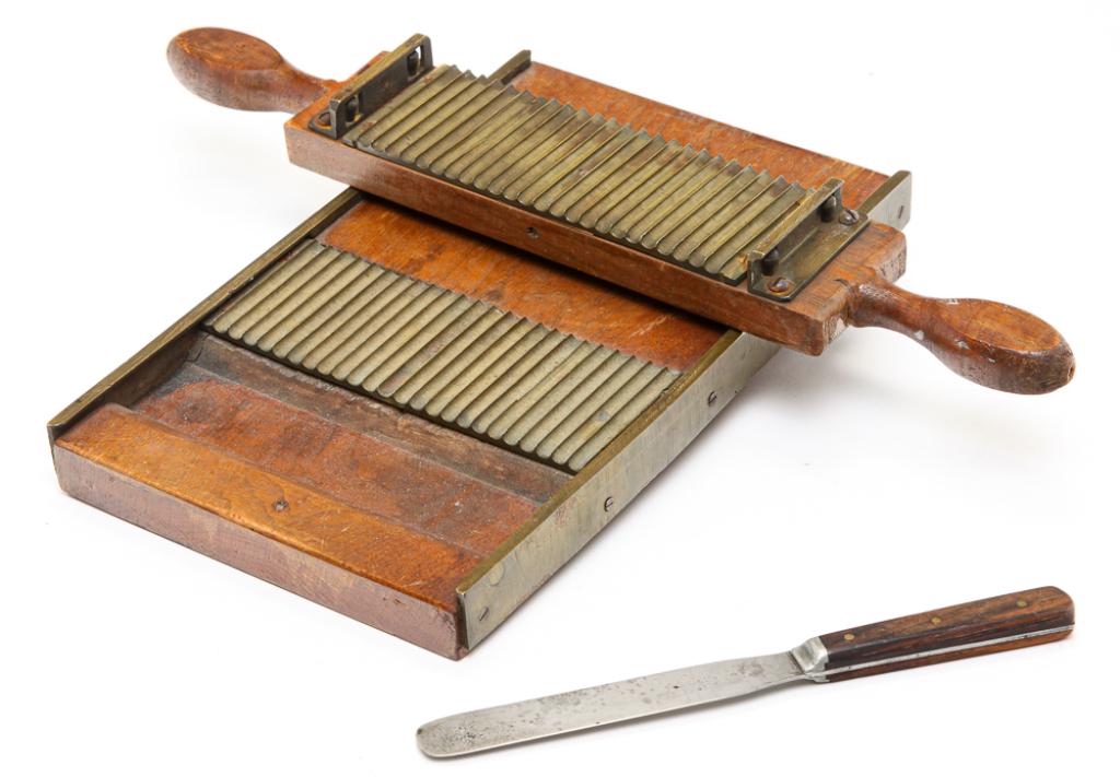 AMERICAN APOTHECARY PILL ROLLER.: Second half 19th century, walnut and brass. In two pieces with roller and tray, 2.75"h. 16"w. 11.5"l. And with a pill counting knife.