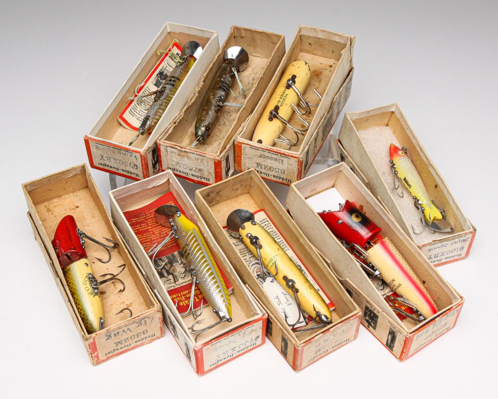 EIGHT LARGER HEDDON FISHING LURES INCLUDING VAMPS.: American, first half 20th century. Group of eight Heddon fishing lures. Includes a Zig Wag, King-Zig Wag, Basser, Vamp, three Vamp Spooks, and a Super Spook. All are in original boxes, some with paper
