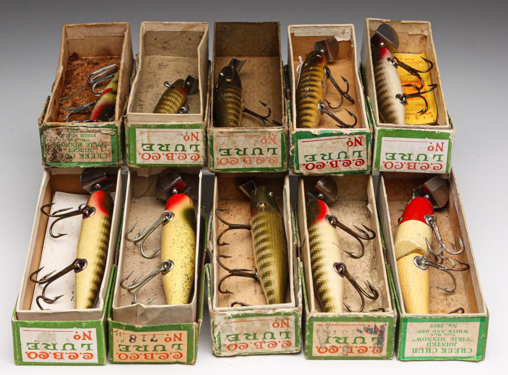 TEN CREEK CHUB BAIT LURES INCLUDING PIKIE MINNOWS.: Group of ten wooden Creek Chub Bait Co. lures with glass eyes. Includes Pikie and Pikie Minnows. All in original boxes, some with paper inserts.