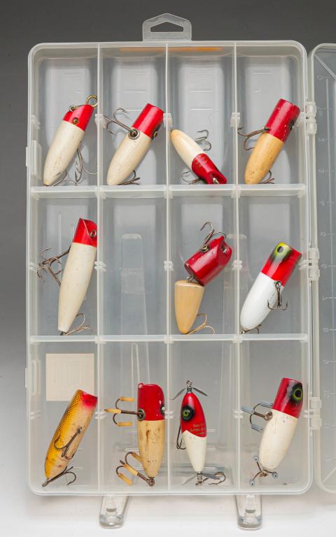 ELEVEN SOUTH BEND WOODEN FISHING LURES.: Group of eleven South Bend wooden fishing lures. Includes Bass Oreno, Spin-I-Diddee, Midge Oreno, and unmarked lures. Some with glass eyes. Also included is a Shimano clear plastic tackle box.