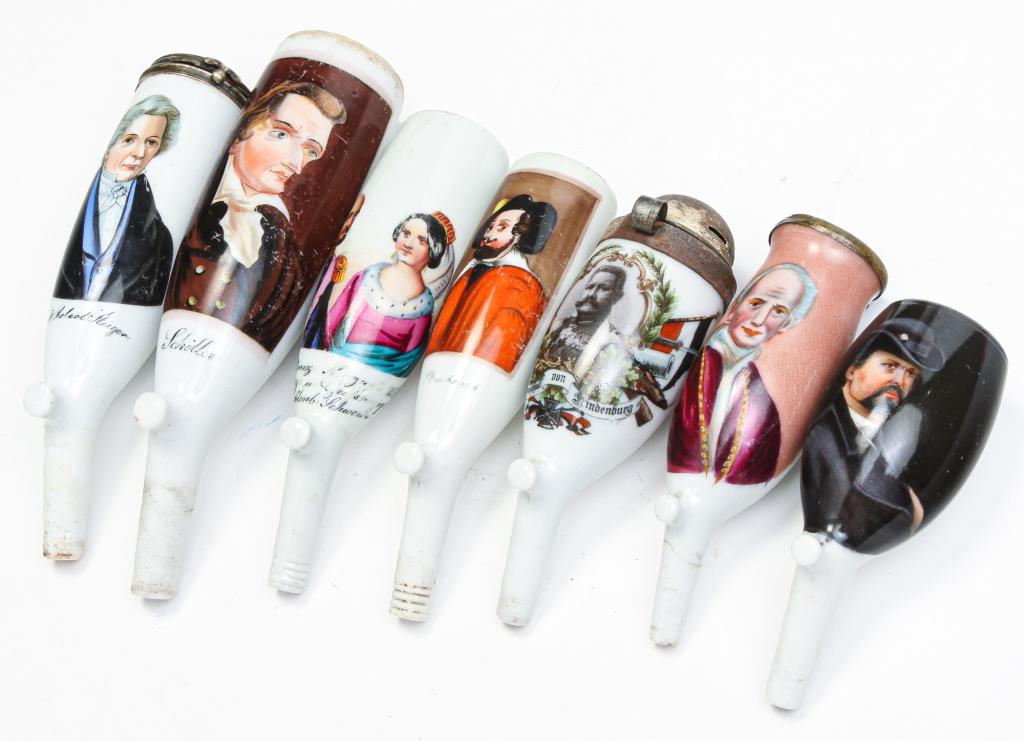 SEVEN GERMAN PORTRAIT PIPE BOWLS.: Late 19th-early 20th century. Five hand painted over transfer images of Pope "Leo XIII" (repair and partial lid), "Dr. F. Robert Steiger", "Konig Ludwig II", "...Hindenburg" (damaged lid), and a man i