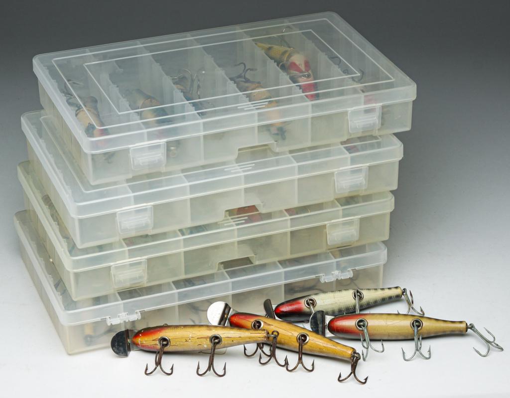TWENTY-THREE CREEK CHUB PIKIE FISHING LURES.: Group of twenty-three Creek Chub Bait Co. Pikie fishing lures. Includes sixteen Pikie lures and seven jointed Pikie lures. Most have glass eyes. Includes four clear plastic tackle boxes.