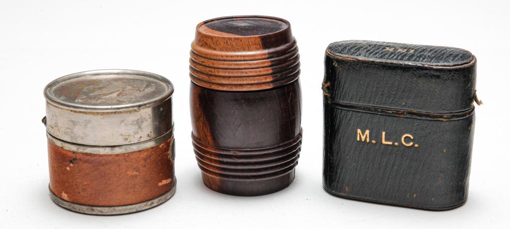 THREE 19TH CENTURY TRAVEL INKWELLS.: Early -mid 19th century. Group of three comprised of: wood barrel case to hold glass ink bottle (included) top unscrews, approx. 2.12"h; worn brown leather over metal cylindrical form with a spring fl