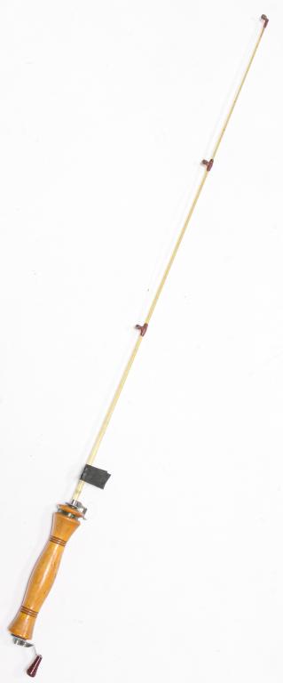 HEDDON ROTO-TIP ICE FISHING ROD.: American, mid-20th century. Heddon Roto-Tip ice fishing fod. Wooden handle with fiberglass rod. Functions properly. 36" overall length.
