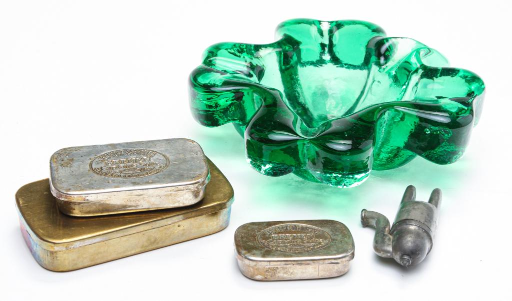 FIVE ITEMS INCLUDING SHAMROCK ASHTRAY.: Twentieth century. Pewter "Chicago Pipe Medicator". Two piece with interior sponge. 3"h. and three tin and brass reproduction nautical tobacco boxes "New York & Bremen, Bremen Captain's Suite". "Made 