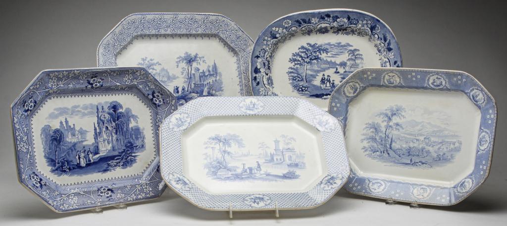 FIVE ENGLIH STAFFORDSHIRE PLATTERS.: Third quarter 19th century, ironstone. Medium blue transfers: family in park with floral border, 11.5"h. 14"w. "Columbia" by Adams, "Historic America" by Mellor Venables and "Genoa" by Adams, 12.25"h.
