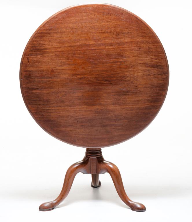 ENGLISH QUEEN ANNE TILT TOP TEA TABLE.: Late 18th century, mahogany. Round top, turned column with bird cage and snake legs with pad feet. Refinished. 28.5"h. 32"d.