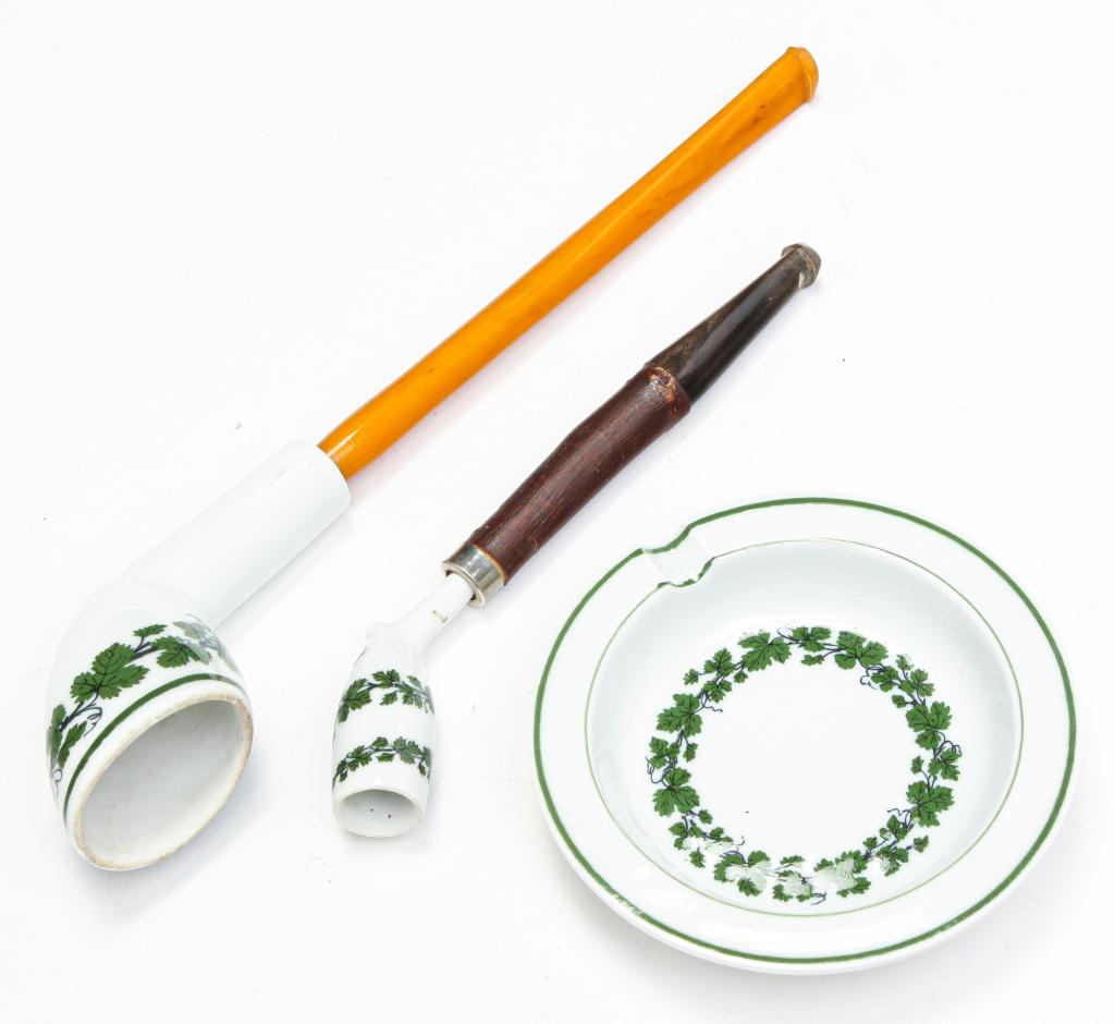 TWO MEISSEN PIPES AND AN ASHTRAY.: Third quarter 19th century. Matching green grapevine decoration. All with underglaze crossed swords mark. Minor wear, handles original? Ashtray, 3.5"d.