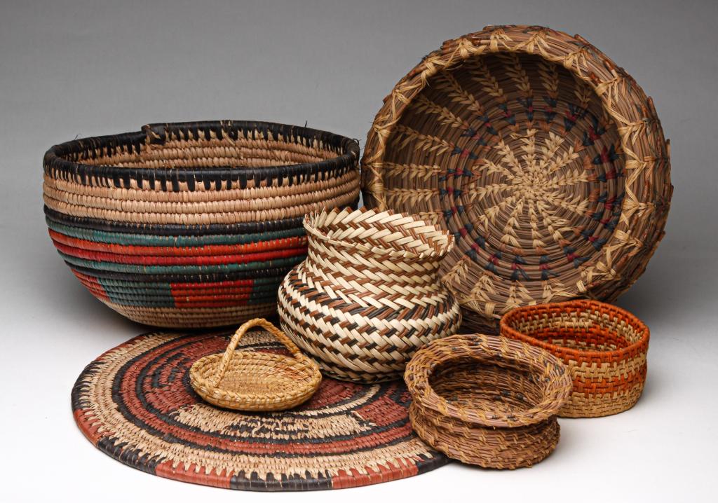 SEVEN BASKETS.: Twentieth century. A Northwest Native American pine needle basket, 3"h. 9.25"d. African and others.