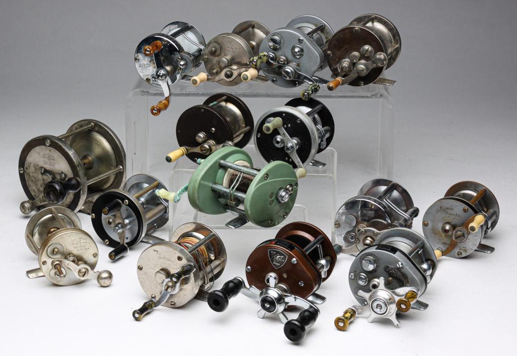 FIFTEEN FISHING REELS.: Mid 20th century. Some bait casters and some with hard rubber panels and bakelite knobs. Includes Shakespeare No. 1900, "Criterion", "Majestic" and Marhoff Patent No. 26, King, Heddon "Pal" and severa