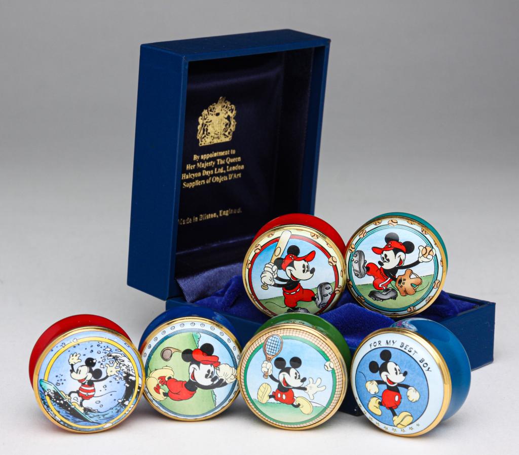 SIX HALCYON DAYS DISNEY ENAMEL BOXES.: Late 20th century. All Mickey Mouse. "Playing Tennis," "At Bat," "Pitching," "Surfing," "For my Best Boy," "Golfing," all from 1996. .75"h. 1.25"d.