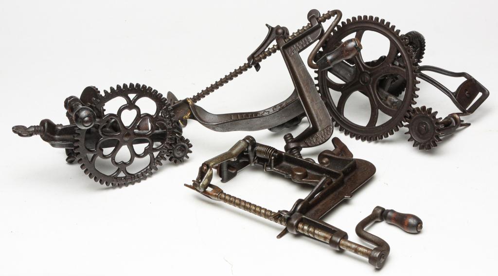 FOUR AMERICAN APPLE PEELERS.: Late 19th century, cast iron. Scott Manufacturing Co., 8"h. "Little Star," 7.5"h. "White Mountain Apple, 7"h. And "72," 8.5"h.
