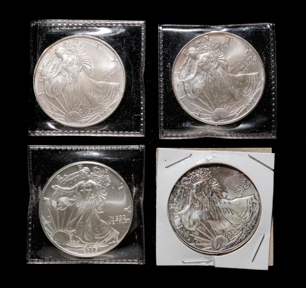 FOUR UNCIRCULATED WALKING LIBERTY SILVER DOLLARS (1 of 2)