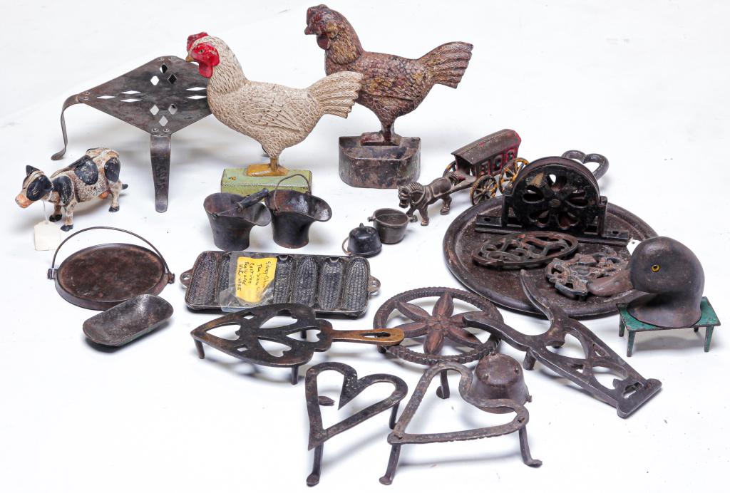 AMERICAN CAST IRON HOUSEWARES.: Early 20th century. Including rooster door stops, trivets, pulleys, molds, miniatures, cow bank, etc. Varying wear and loss. Approximately 20 items. Doorstop 8.25" h.