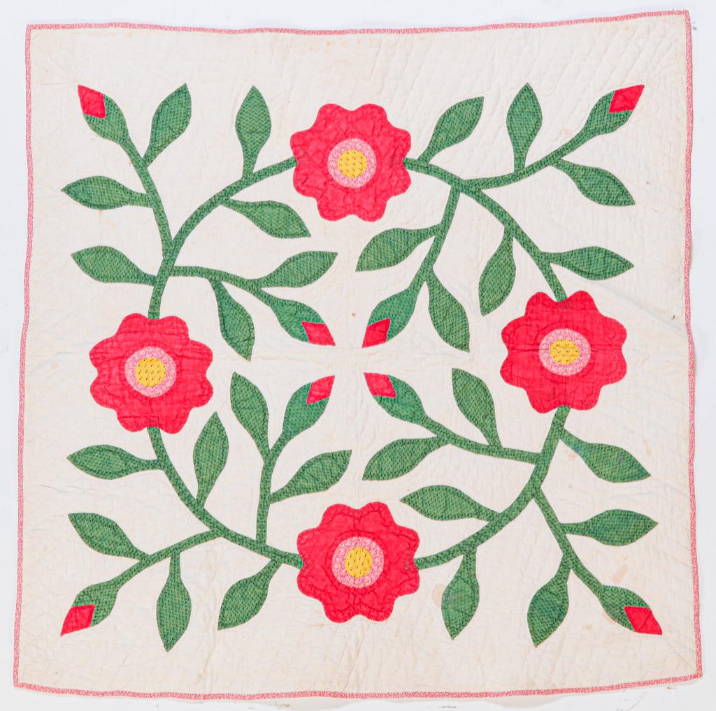 AMERICAN APPLIQUE CRIB QULT.: Late 19th century. Four color floral applique design. Hand stitched. Staining and edge wear. 34" x 34".