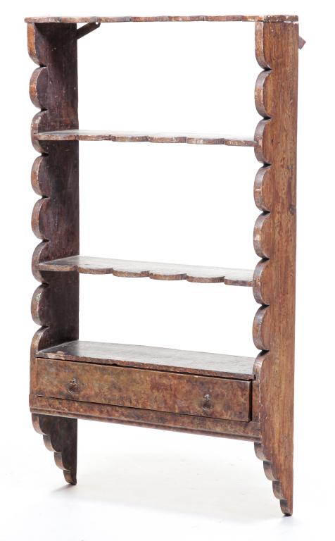 AMERICAN DECORATED SET OF SHELVES.: Second quarter 19th century, pine. Scalloped ends and shelves with lower, dovetailed drawer. Worn, original, sponge painting. Some repair and loss. 44"h. 23.5"w. 7.5"d.