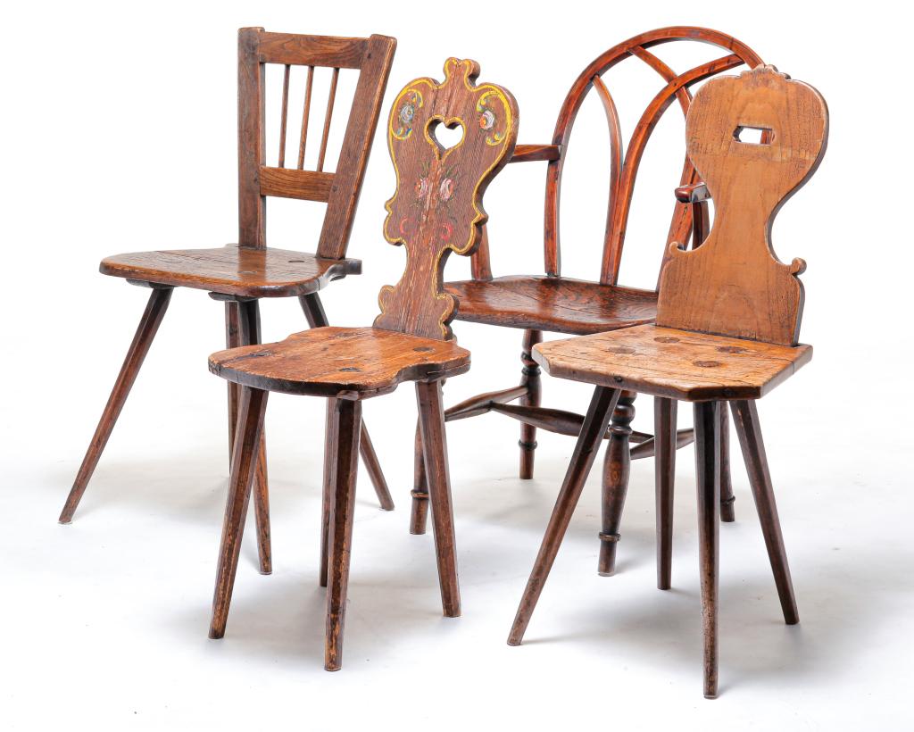 FOUR EUROPEAN CHAIRS.: Nineteenth century. Two Moravian with shaped backs, cut out handle holds and chamfered legs. Original floral paint. Glued and nailed repairs, age splits, replaced pegs. And old tan paint. Wear, nailed