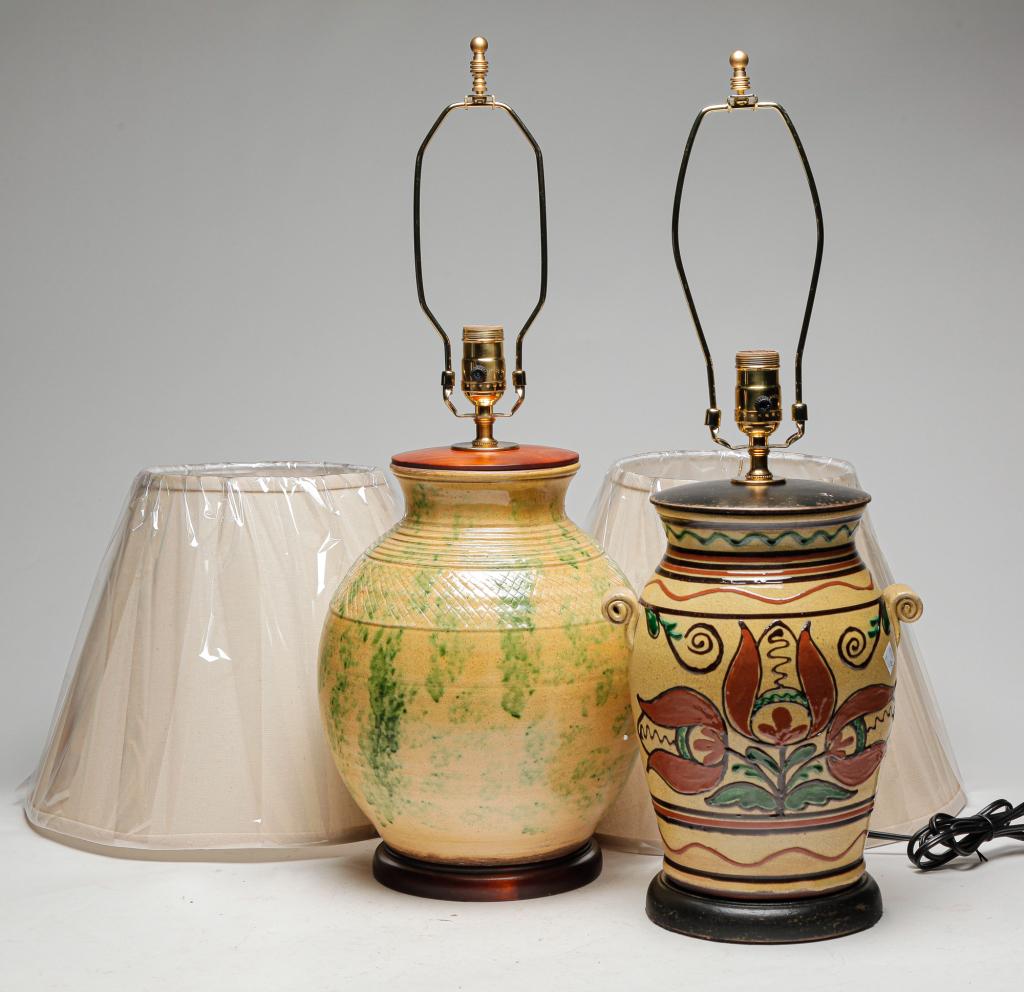 TWO TURTLE CREEK REDWARE TABLE LAMPS.: Ohio, early 21st century. Tulip slip decoration on yellow. Signed and dated 2020. 25"h. And sponged green on yellow. Unsigned. 26"h. Includes harps and shades. From the work shops of David T. Smith.