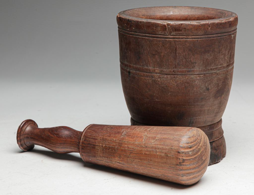 TREENWARE MORTAR AND PESTLE.: American or European, 19th century. Lignum vitae with old surface and wear. Some splits and chips, scorched at bottom. 7.5"h.