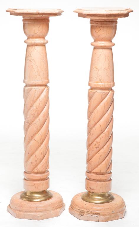 PAIR OF EUROPEAN MARBLE COLUMNS.: Early 20th century. Pink marble with brown striations. Octagonal tops and rope twist columns with brass trim. One piece, tops plastered on with traces of glue. Some chips. 44"h. 13"d.