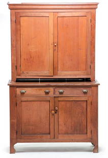 AMERICAN STEPBACK CUPBOARD.: Mid 19th century, walnut with poplar secondary. In two pieces, top with ogee cornice, blind doors, pie shelf and base with two dovetailed drawers, paneled doors and cut-out feet. Finish wear and