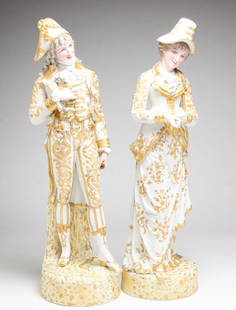 LARGE PAIR OF EUROPEAN BISQUE FIGURINES.: Late 19th century. Male and female in 18th century style costume. Gold trim and decoration. Female, 27.5"h. Male, 27.75"h.