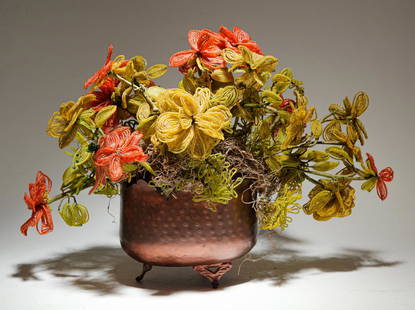 BEADED FLOWER ARRANGEMENT.: Mid 20th century. Orange and yellow flowers in a footed copper planter. 15"h.