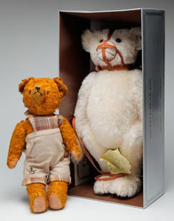 TWO TEDDY BEARS.: Twentieth century. Steiff "Muzzel Bear" no 1306/2650 in original box, 22"h. And older Teddy Bear in newer clothes, wear, 17"h.