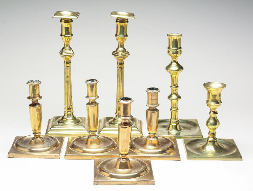 EIGHT EUROPEAN BRASS CANDLE STICKS. (1 of 4)