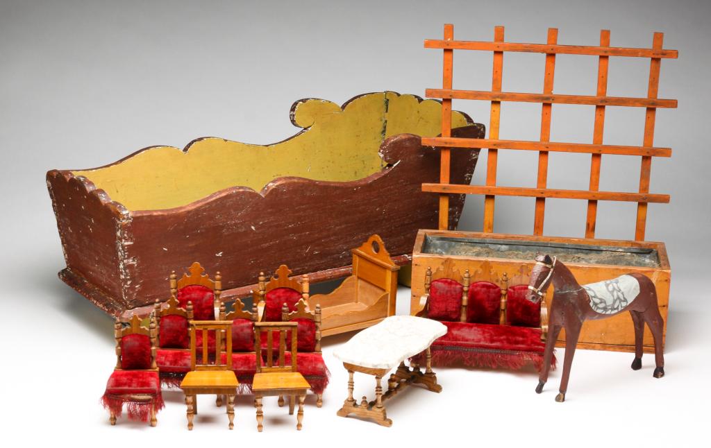 GROUP OF DOLL HOUSE FURNITURE AND ETC.: Nineteenth and 20th centuries. Doll cradle, 9.5"h. Planter with trellis back, 15"h. Horse, 7.25"h. And 11 pieces of doll house furniture.