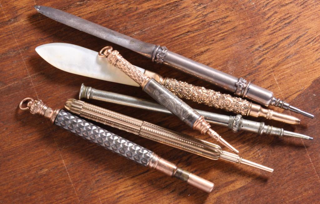 SIX ANTIQUE RETRACTABLE PENCILS. (1 of 2)
